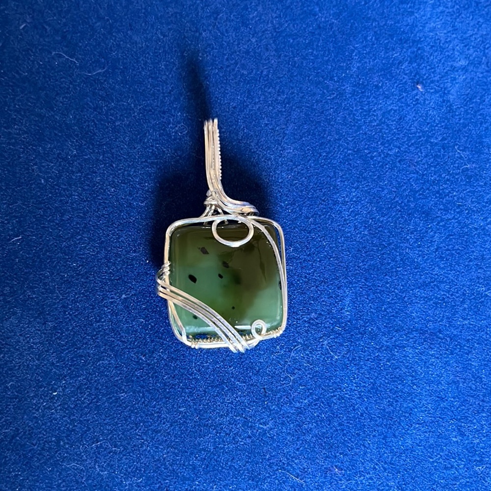 Gorgeous silver pendant with a green stone